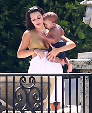 Picture Shows: Kim Kardashian, Saint West September 19, 2016 **Min ¿300 Web / Online Set Usage Fee** Kim Kardashian and her kids North and Saint enjoy a day poolside with Larsa Pippen in Miami, Florida. Kim showed off her curvy figure in a gold bikini, which slipped down at one point revealing her nipple. **Min ¿300 Web / Online Set Usage Fee** Exclusive UK RIGHTS ONLY Pictures by : FameFlynet UK ¿ 2016 Tel : +44 (0)20 3551 5049 Email : info@fameflynet.uk.com